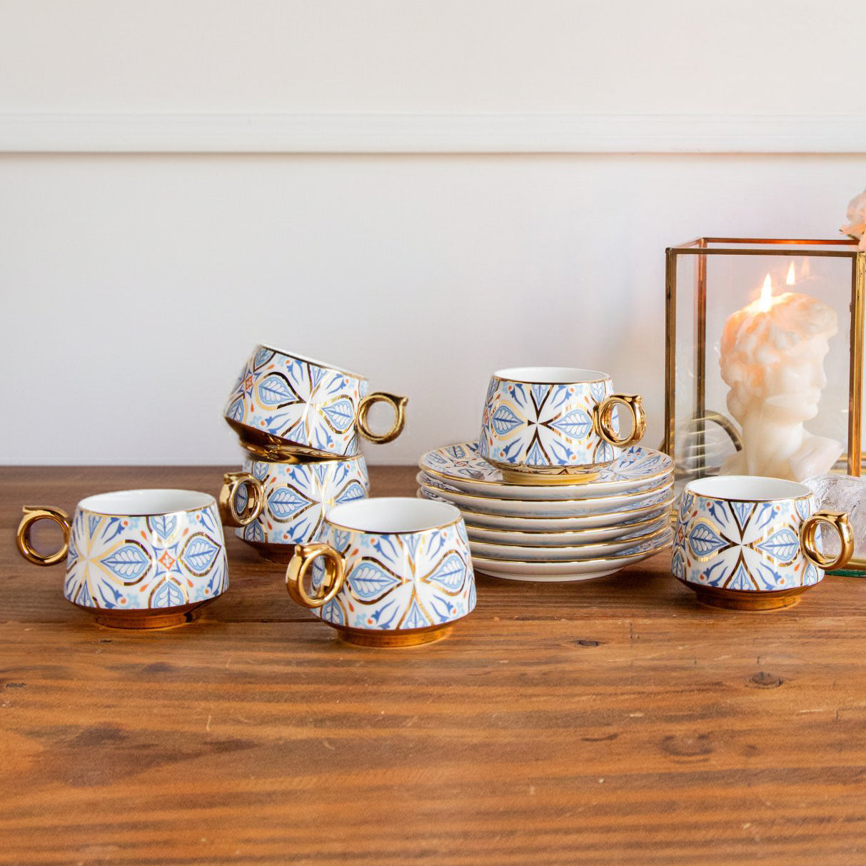 Set of ceramic cups with decorative patterns on a wooden surface image