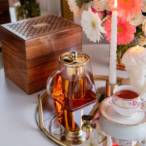 
                  
                    Load image into Gallery viewer, Pyramid Shape Borosilicate Teapot With Gold Plated Infuser And Lid in a Sesham Wood Box- 720 ML
                  
                